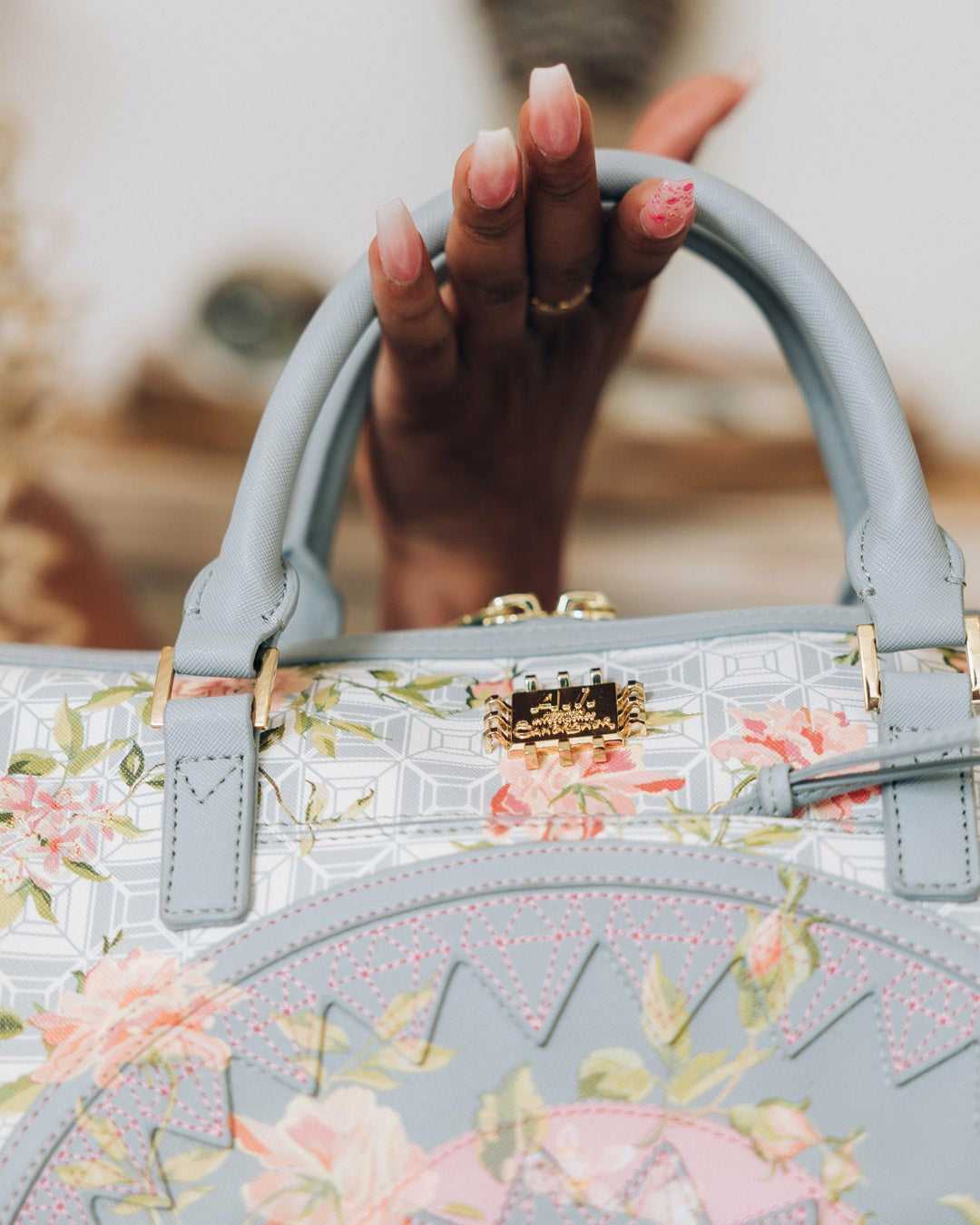 A.I. AFRICAN INTELLIGENCE ELEGANT ENERGY MINI DUFFLE - SANDFLOWER COLL